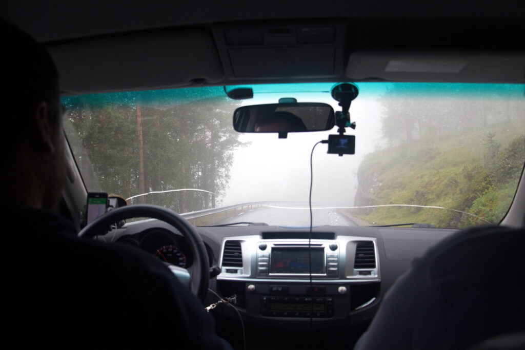 view from a car to a foggy road